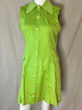 This Vintage Finnish Exclusion green and yellow polka dot dress in size medium